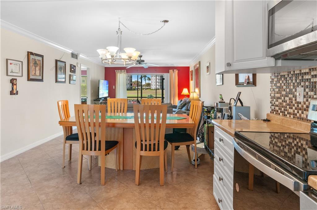 49 High Point Circle South, Unit 102 Naples, FL 34103 - Photo 6 of 42 Large dining area, open concept
