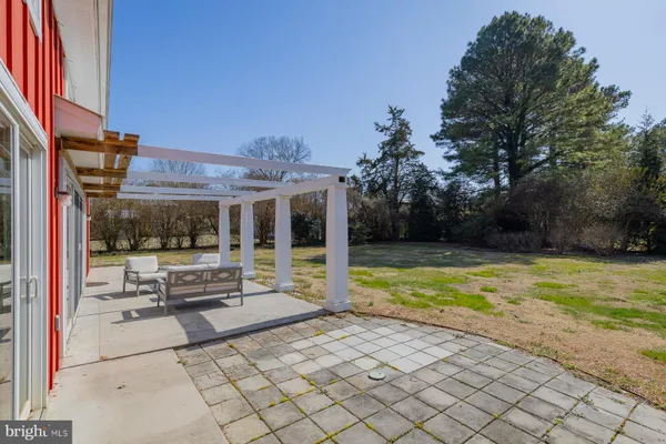 a view of house with outdoor seating space