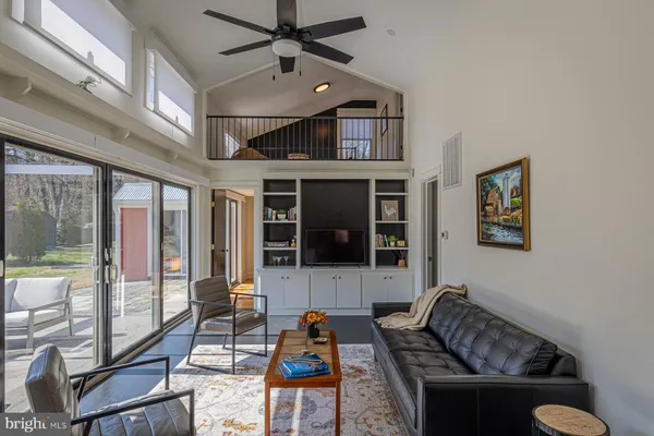 a living room with furniture and a window
