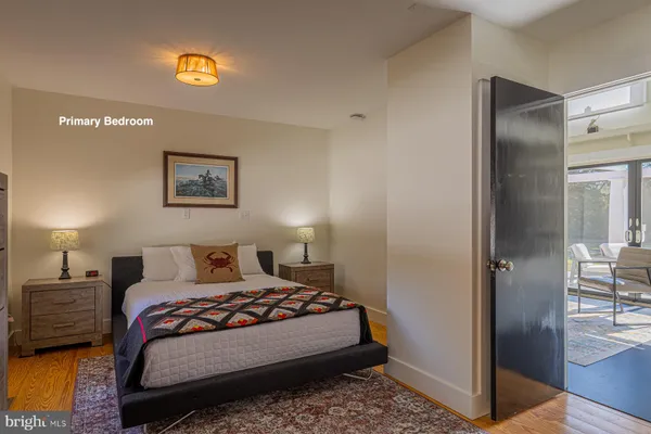 a bedroom with a bed and a view of bathroom