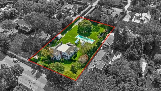a view of a yard with potted plants