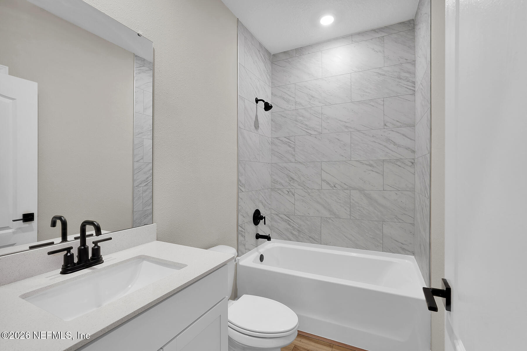 2420 Pemrose Loop Middleburg, FL 32068 - Photo 19 of 25 a bathroom with a sink a toilet and a bathtub