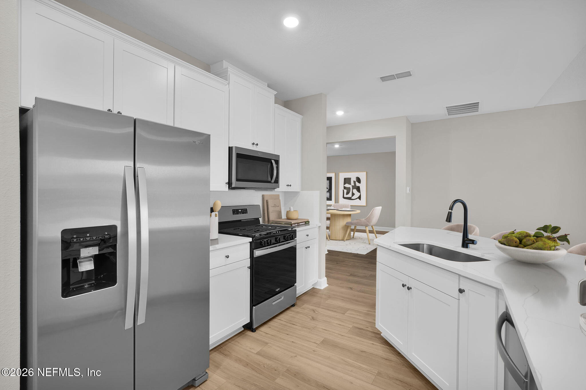 2420 Pemrose Loop Middleburg, FL 32068 - Photo 10 of 25 a kitchen with a sink stainless steel appliances and cabinets