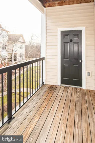 a view of a balcony with a potted plant