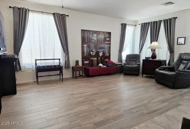 a living room with furniture and a window