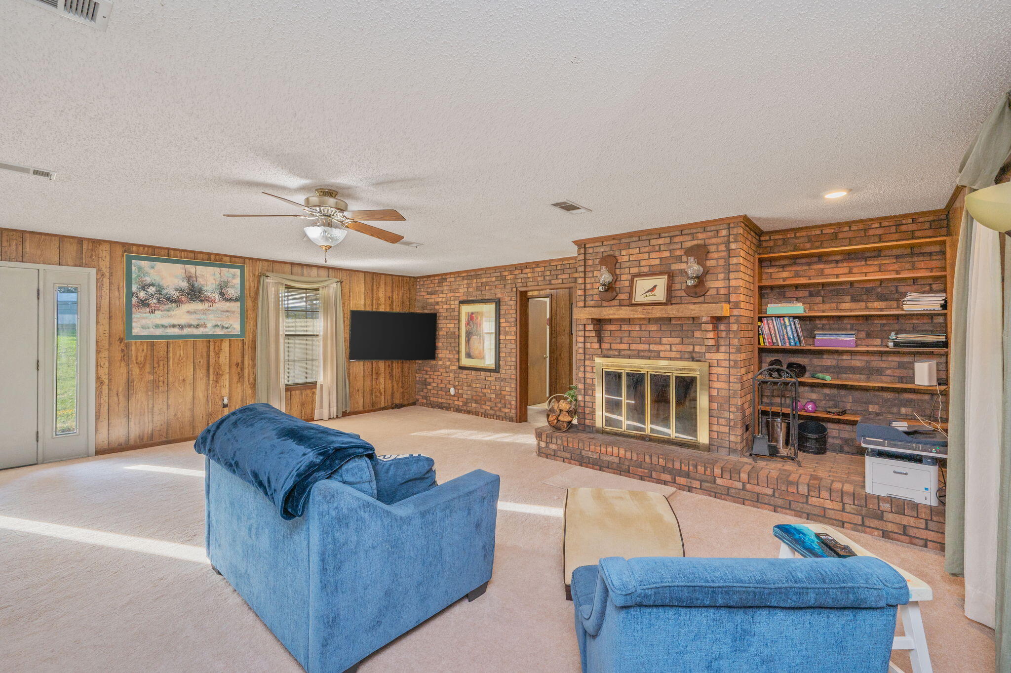 1260 East Chestnut Avenue Crestview, FL 32539 - Photo 16 of 61 a living room with furniture and a flat screen tv