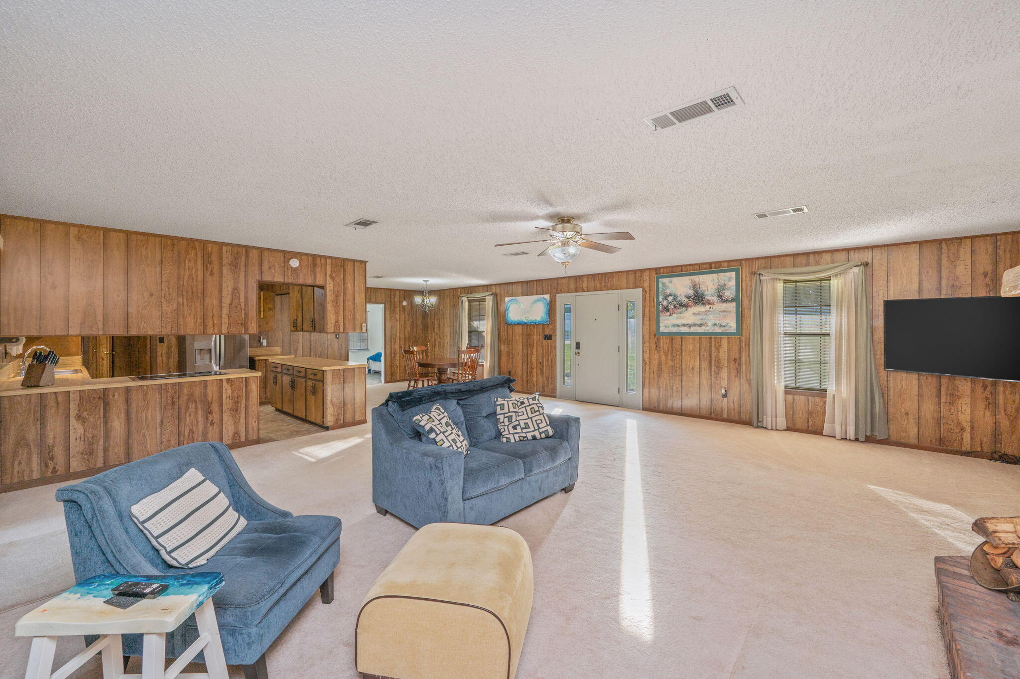 1260 East Chestnut Avenue Crestview, FL 32539 - Photo 17 of 61 a living room with furniture and a view of kitchen