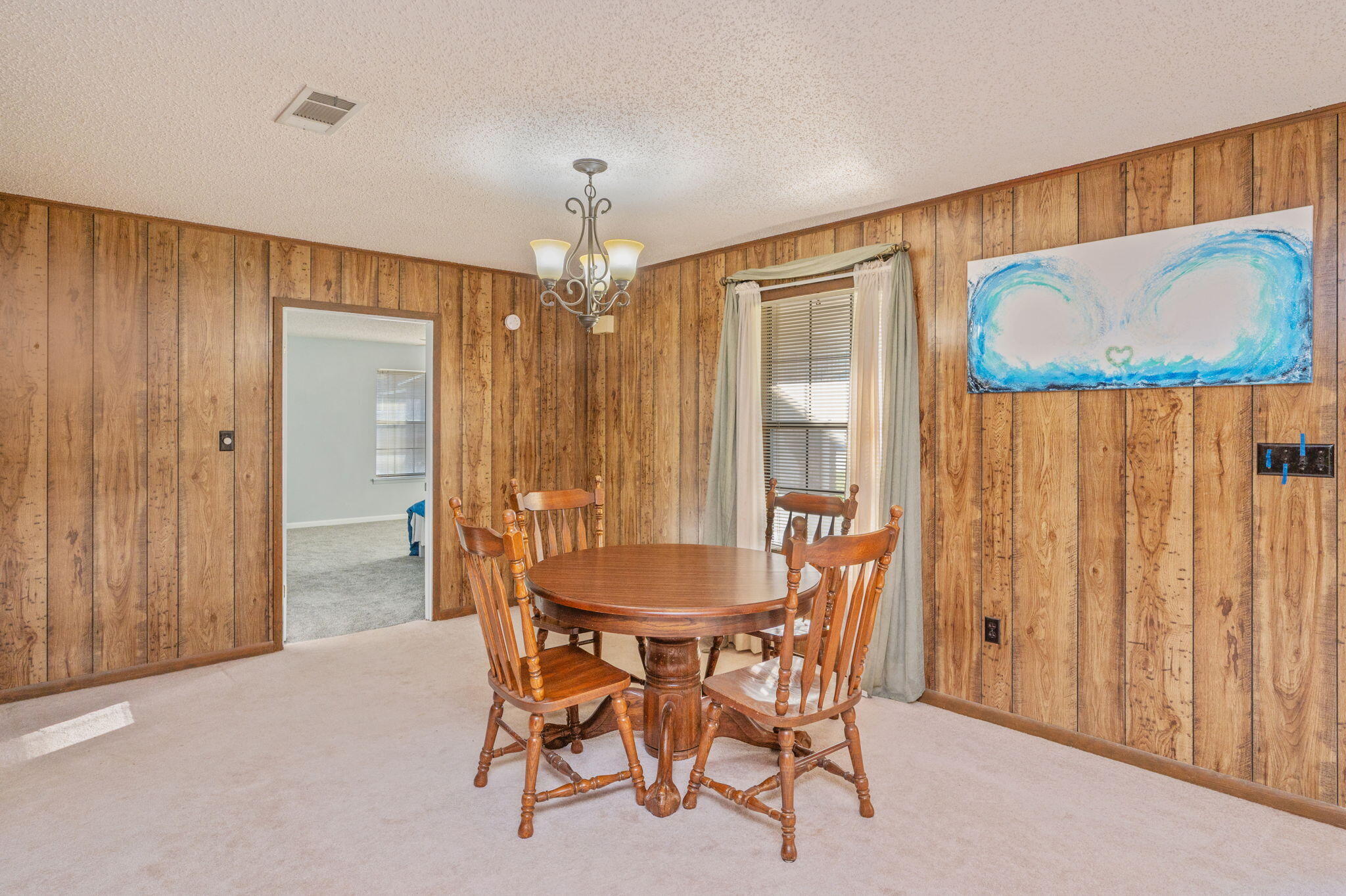 1260 East Chestnut Avenue Crestview, FL 32539 - Photo 18 of 61 a dining room with furniture and window