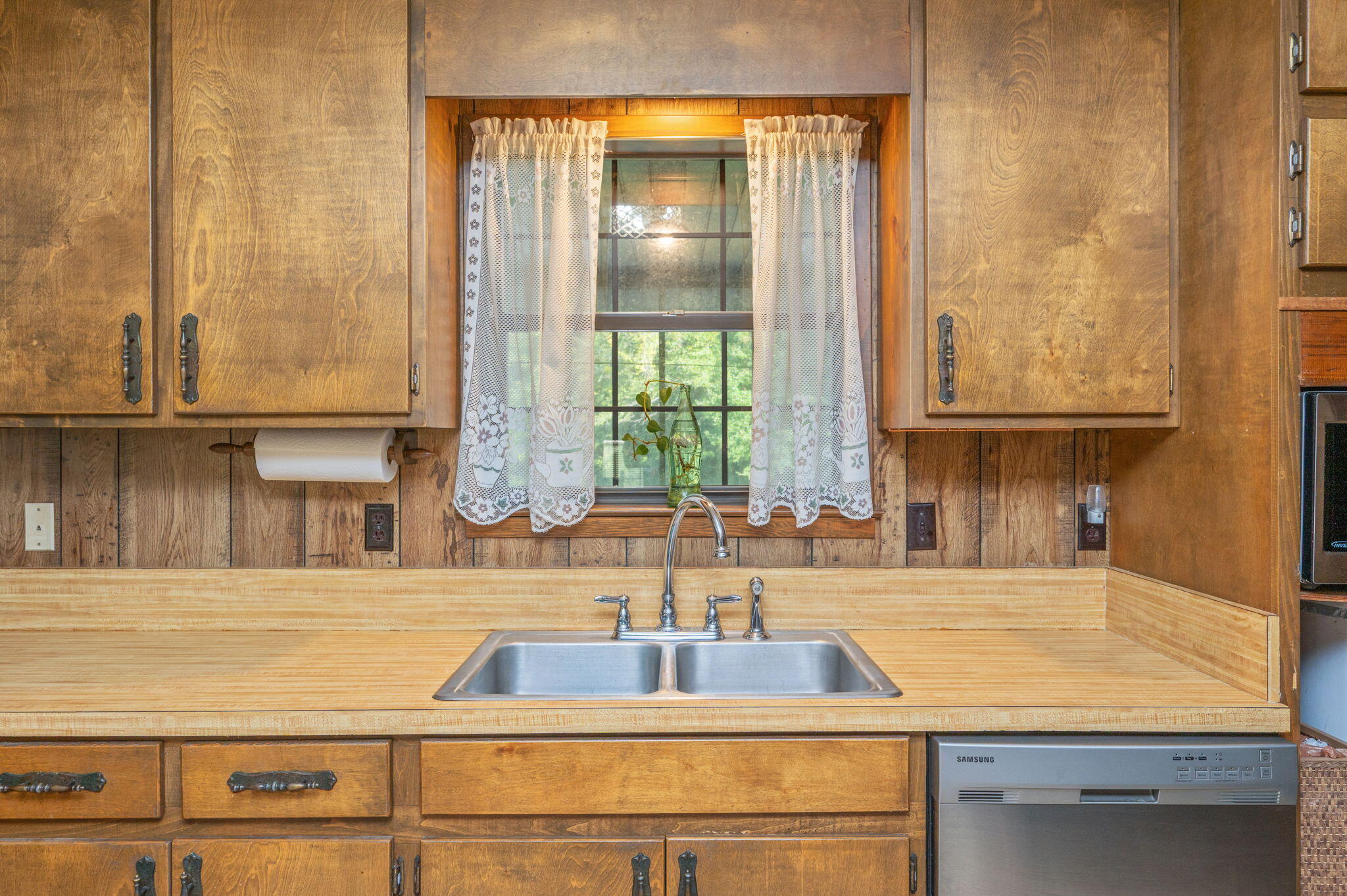 1260 East Chestnut Avenue Crestview, FL 32539 - Photo 23 of 61 a kitchen with granite countertop a sink and a window