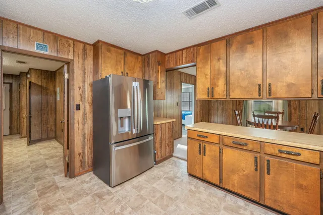 a bedroom with a bed and a cabinets
