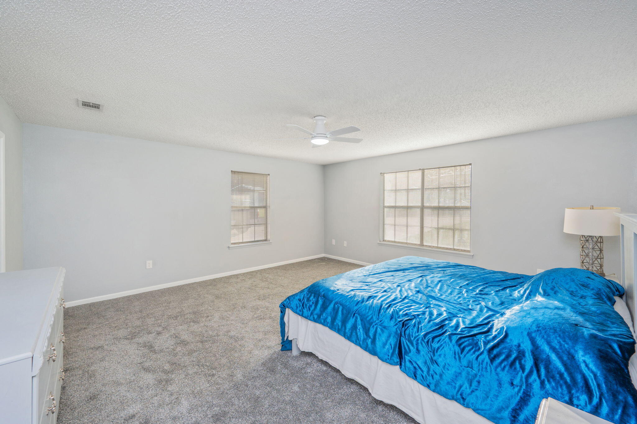 1260 East Chestnut Avenue Crestview, FL 32539 - Photo 25 of 61 a bedroom with a bed and a window