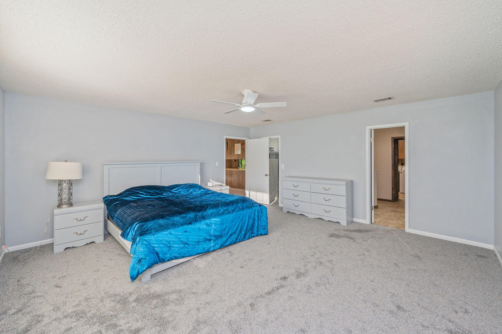 1260 East Chestnut Avenue Crestview, FL 32539 - Photo 27 of 61 a bedroom with a bed and a cabinets