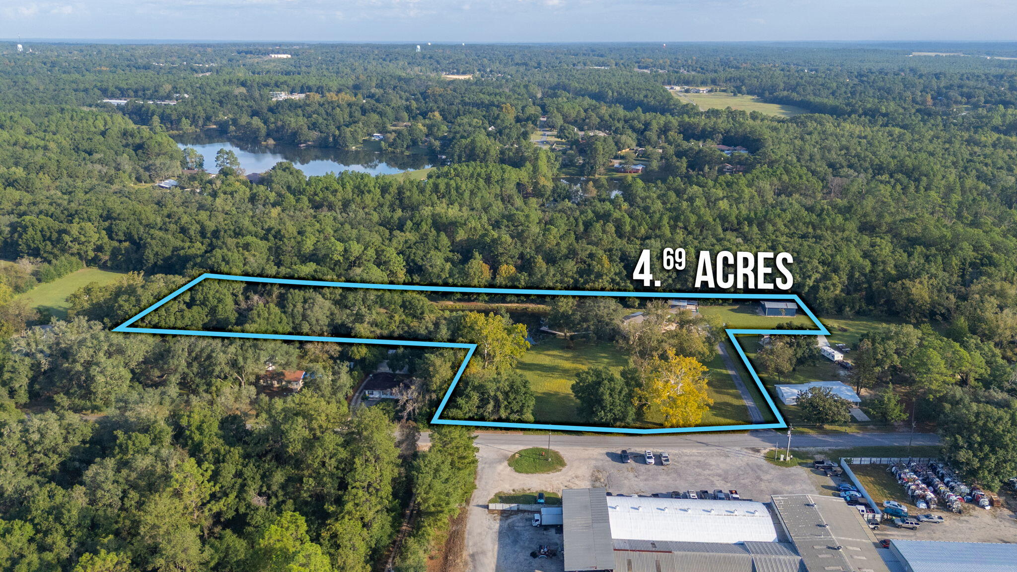 1260 East Chestnut Avenue Crestview, FL 32539 - Photo 3 of 61 an aerial view of residential houses with outdoor space