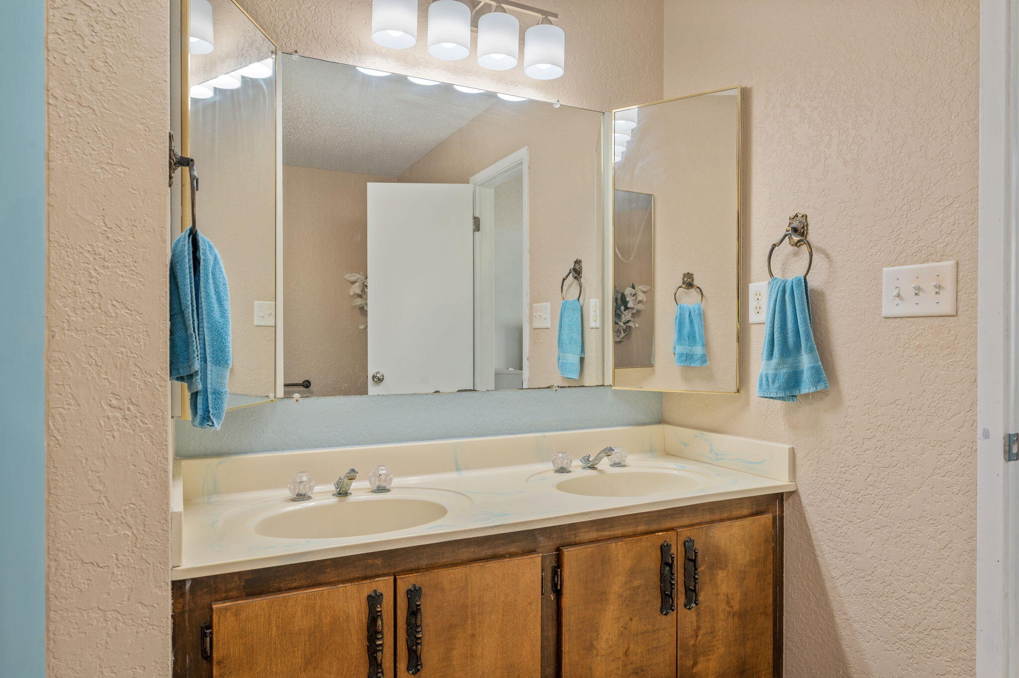1260 East Chestnut Avenue Crestview, FL 32539 - Photo 31 of 61 a bathroom with a sink and a mirror