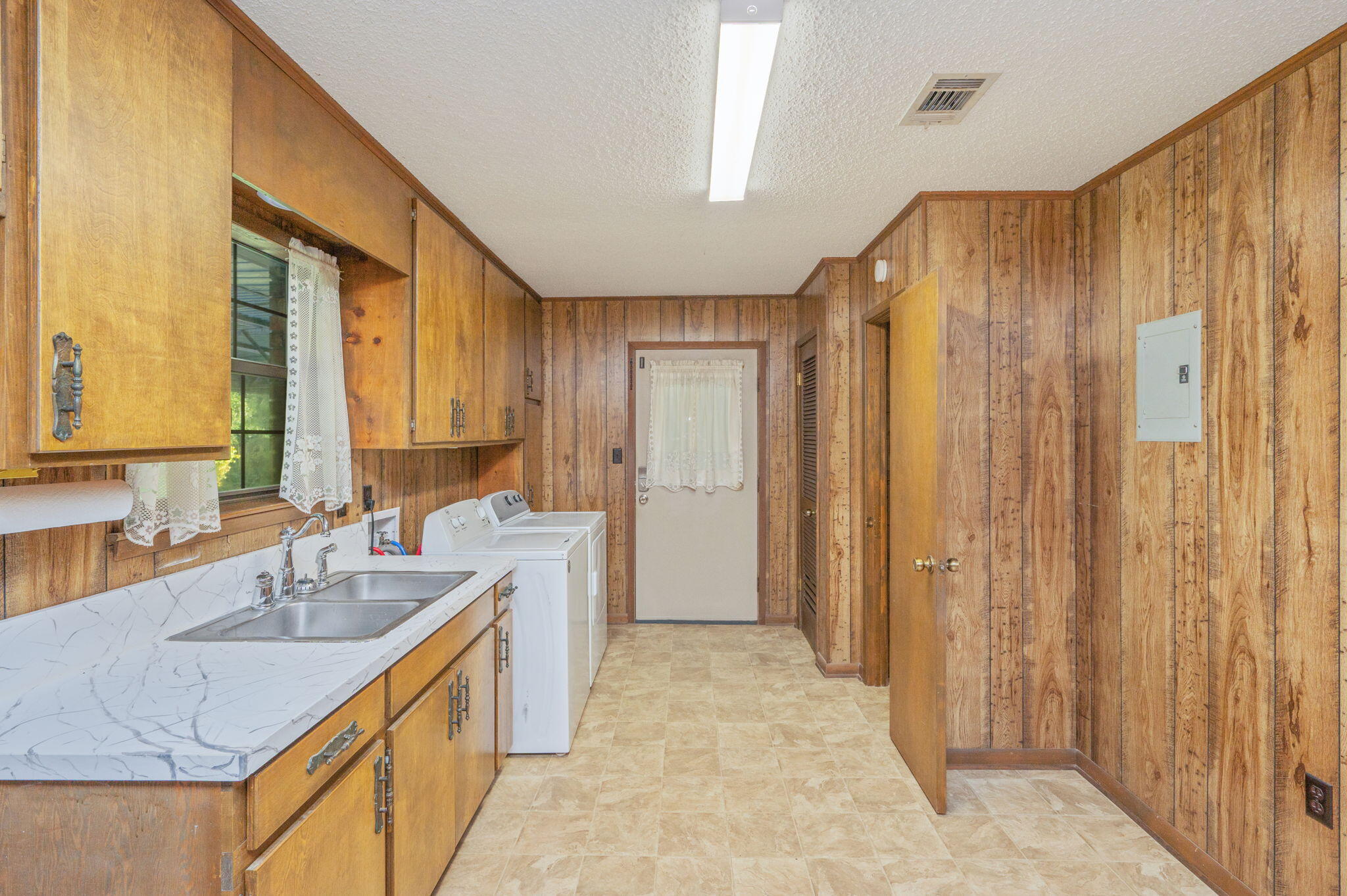 1260 East Chestnut Avenue Crestview, FL 32539 - Photo 36 of 61 a bathroom with a granite countertop sink and a mirror