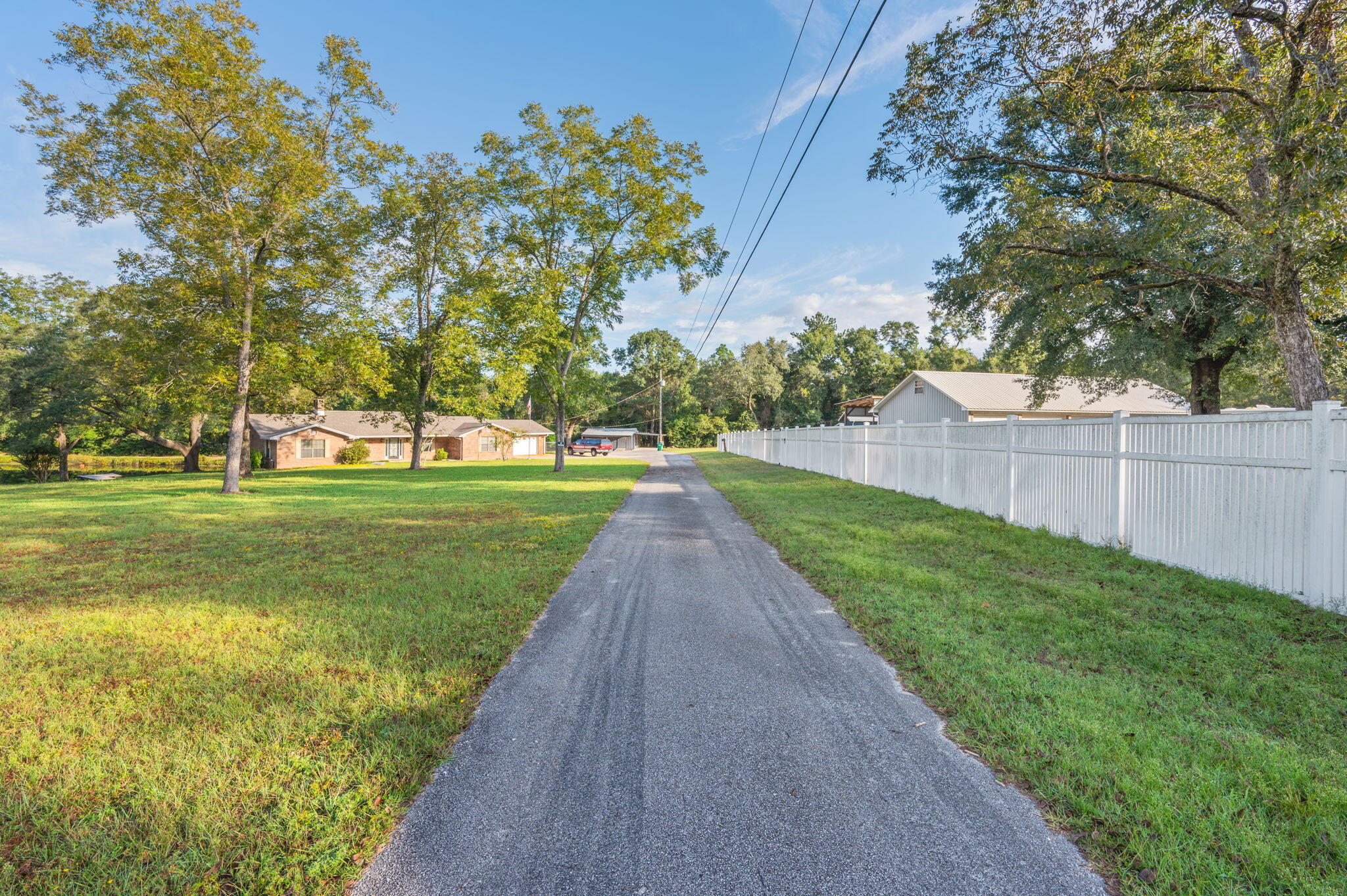 1260 East Chestnut Avenue Crestview, FL 32539 - Photo 50 of 61 a view of a garden with trees