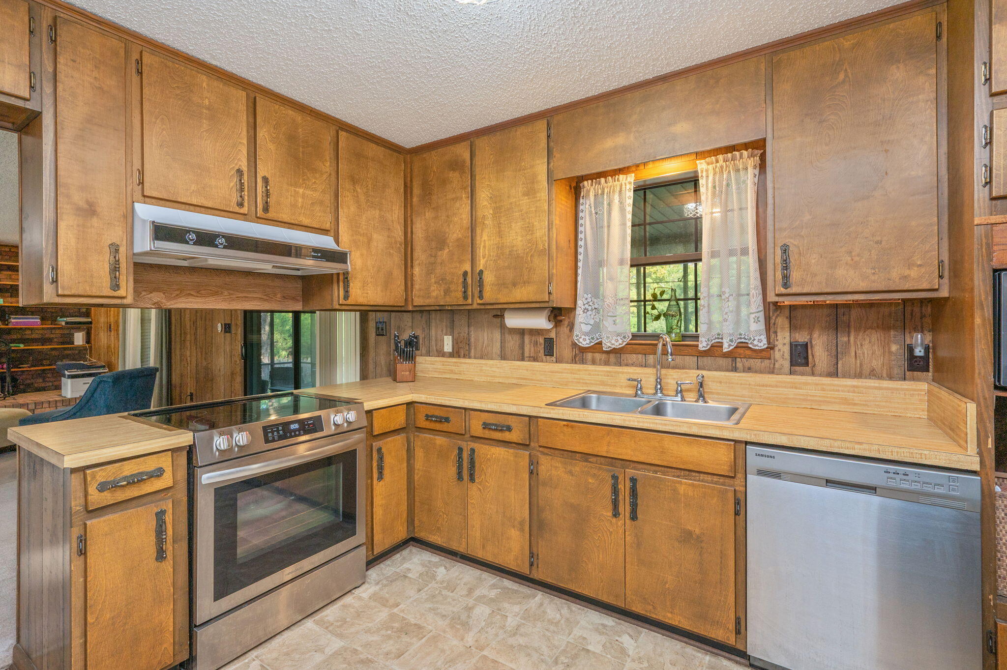 1260 East Chestnut Avenue Crestview, FL 32539 - Photo 7 of 61 a kitchen with a sink stove and cabinets