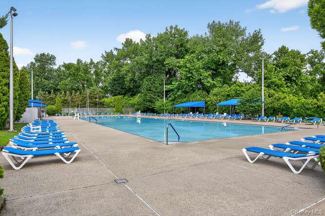 46 Terrace Circle, Unit 1B Great Neck, NY 11021 - Photo 11 of 16 a park view with a bench