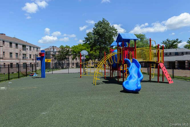 46 Terrace Circle, Unit 1B Great Neck, NY 11021 - Photo 13 of 16 a view of outdoor space with trampoline