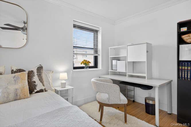 46 Terrace Circle, Unit 1B Great Neck, NY 11021 - Photo 7 of 16 a living room with furniture and a window