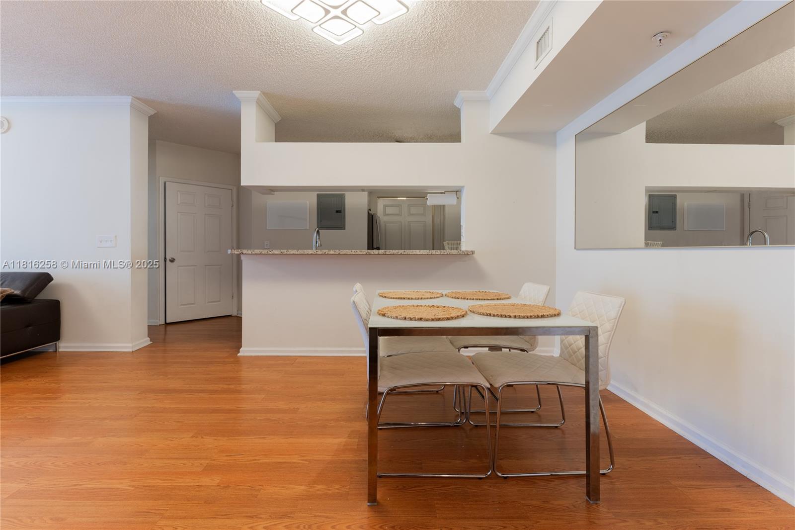 17100 North Bay Road, Unit PH1912 Sunny Isles Beach, FL 33160 - Photo 2 of 39 a view of kitchen with furniture and wooden floor