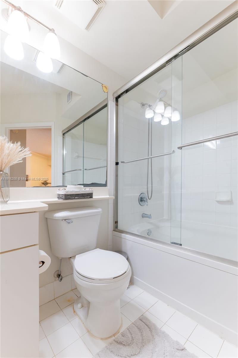 17100 North Bay Road, Unit PH1912 Sunny Isles Beach, FL 33160 - Photo 30 of 39 a bathroom with a toilet sink and shower