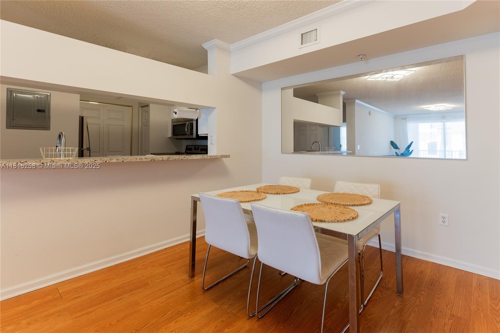 17100 North Bay Road, Unit PH1912 Sunny Isles Beach, FL 33160 - Photo 3 of 39 a view of a dining room with furniture