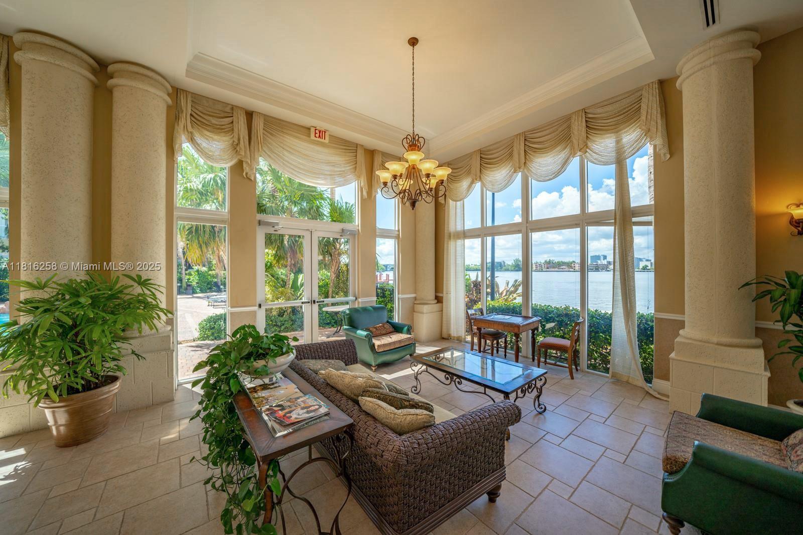17100 North Bay Road, Unit PH1912 Sunny Isles Beach, FL 33160 - Photo 38 of 39 a living room with furniture and floor to ceiling windows