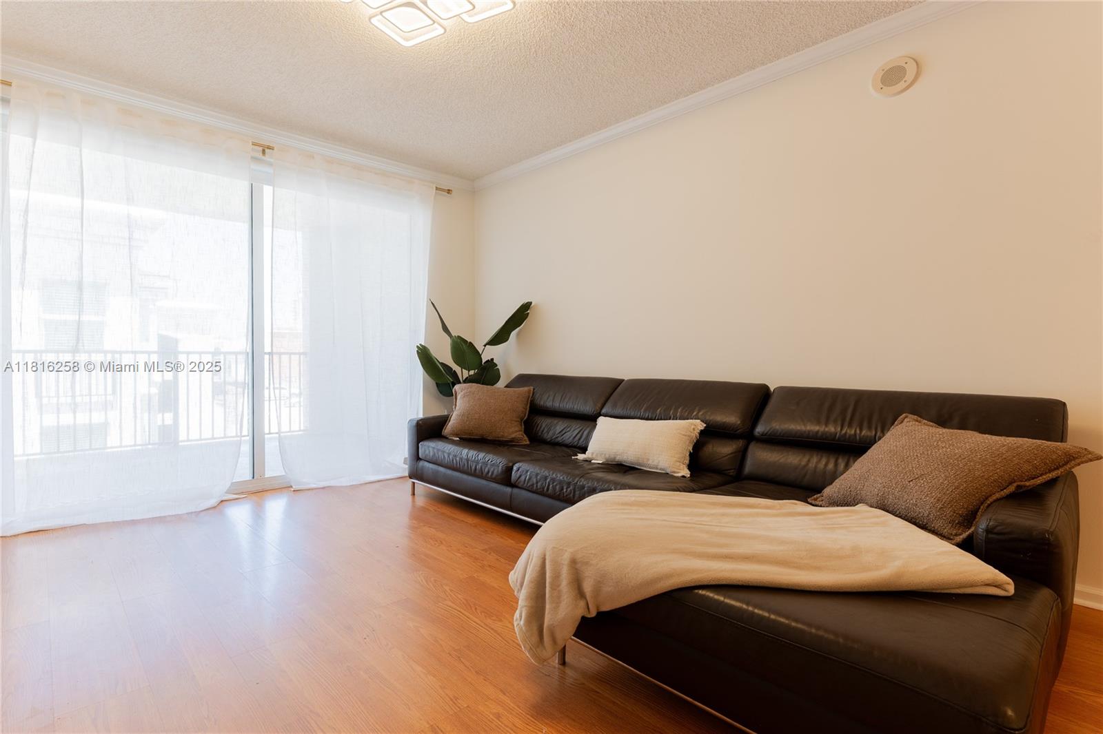 17100 North Bay Road, Unit PH1912 Sunny Isles Beach, FL 33160 - Photo 5 of 39 a bedroom with a bed and wooden floor