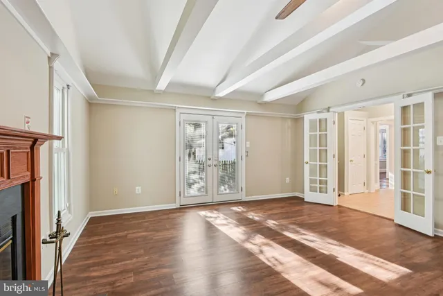 a view of livingroom with hardwood floor and a ceiling fan