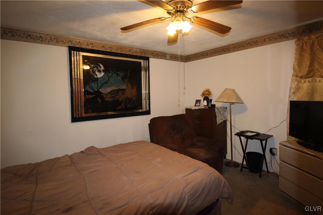 157 Maple Road Blakeslee, PA 18610 - Photo 11 of 19 a bedroom with a bed and a painting on the wall