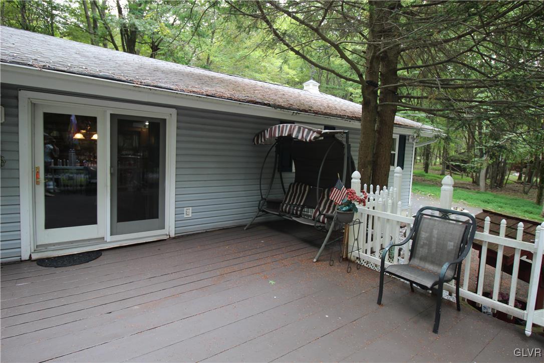 157 Maple Road Blakeslee, PA 18610 - Photo 18 of 19 a view of a chairs and table in backyard of the house