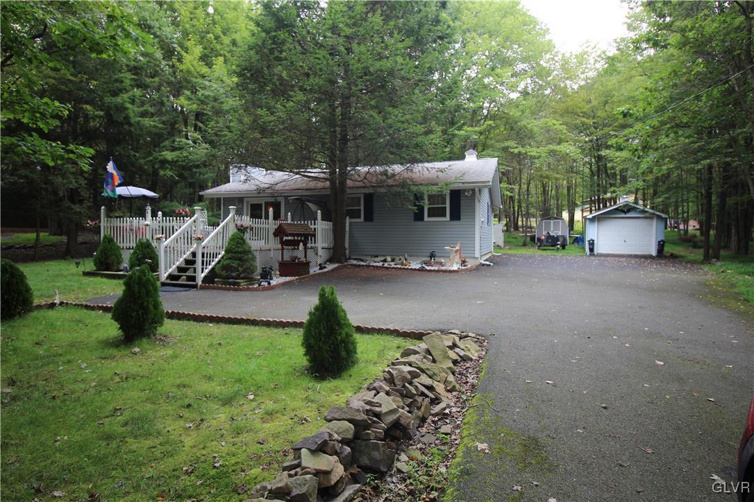 157 Maple Road Blakeslee, PA 18610 - Photo 2 of 19 a view of a house with backyard sitting area and garden