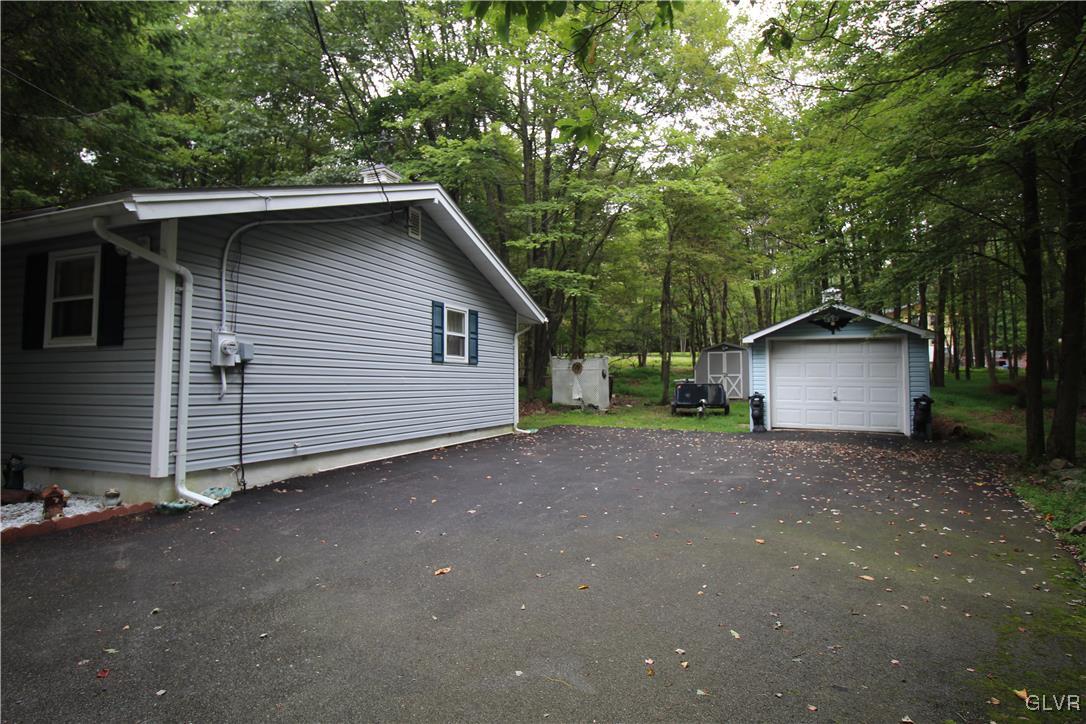 157 Maple Road Blakeslee, PA 18610 - Photo 3 of 19 a view of backyard of house with trees