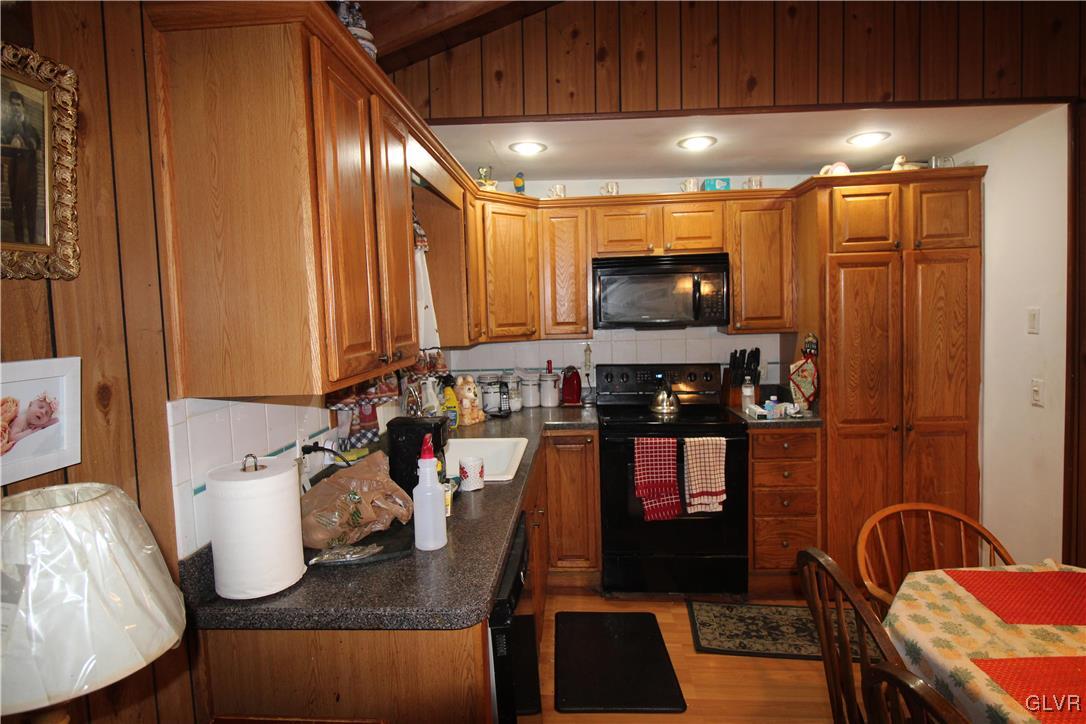 157 Maple Road Blakeslee, PA 18610 - Photo 7 of 19 a kitchen with a sink and a refrigerator