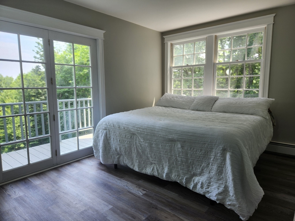 134 Mountain Road Princeton, MA 01541 - Photo 13 of 29 a bedroom with a bed and a large window