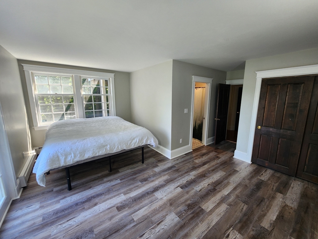 134 Mountain Road Princeton, MA 01541 - Photo 14 of 29 a bedroom with a bed and a large window