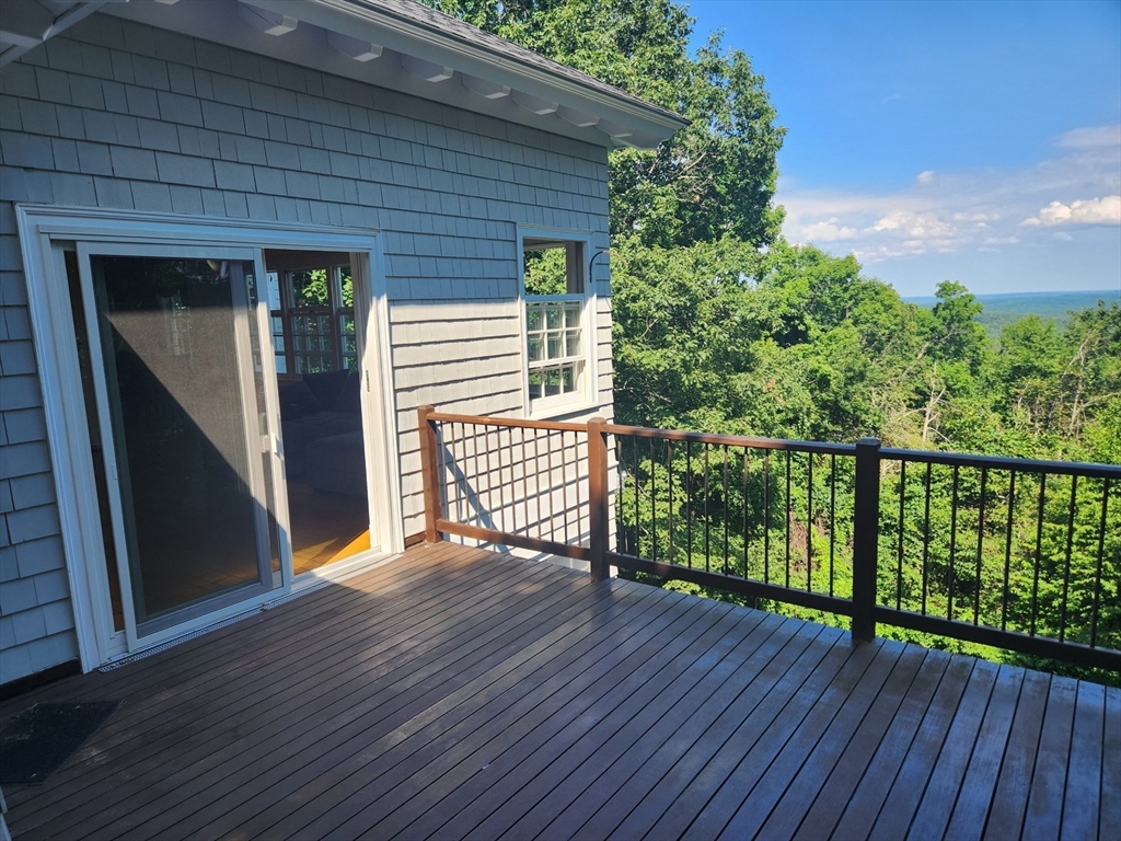 134 Mountain Road Princeton, MA 01541 - Photo 24 of 29 a view of a deck with wooden floor and wooden floor