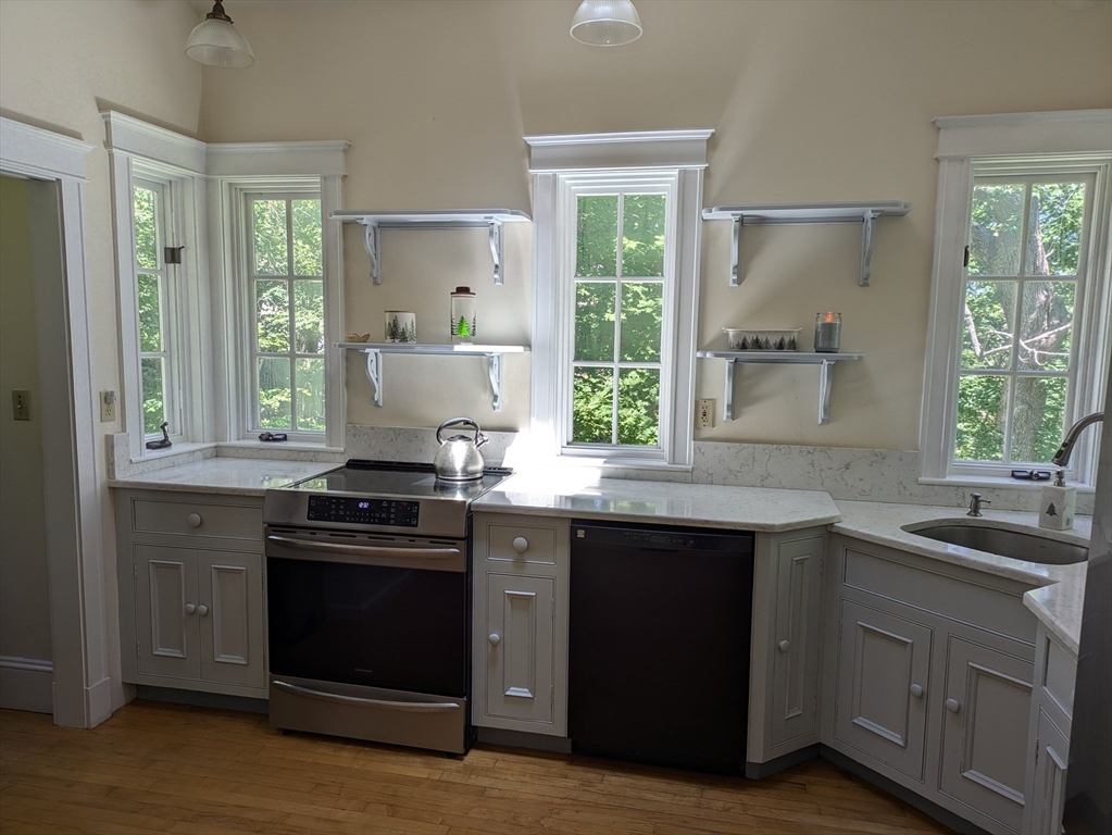 134 Mountain Road Princeton, MA 01541 - Photo 6 of 29 a kitchen with a sink stove and cabinets