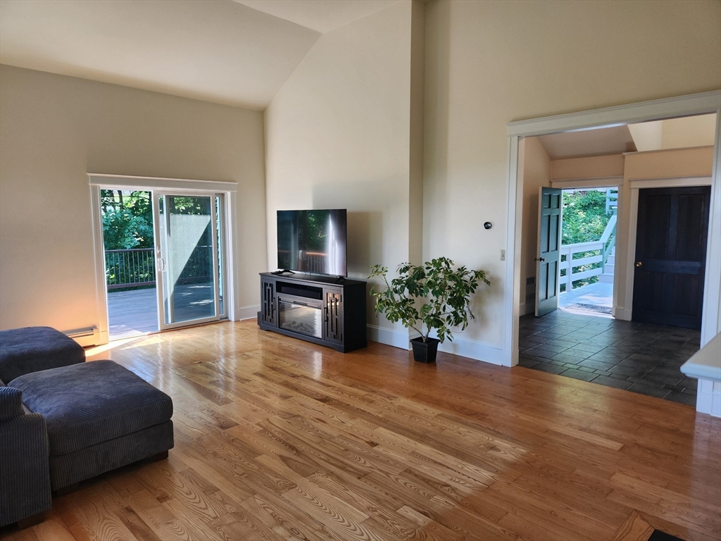 134 Mountain Road Princeton, MA 01541 - Photo 8 of 29 a living room with furniture and a flat screen tv