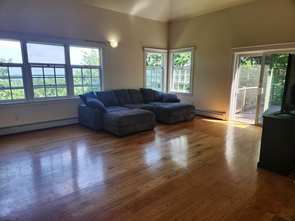 134 Mountain Road Princeton, MA 01541 - Photo 10 of 29 a living room with couches and a large window