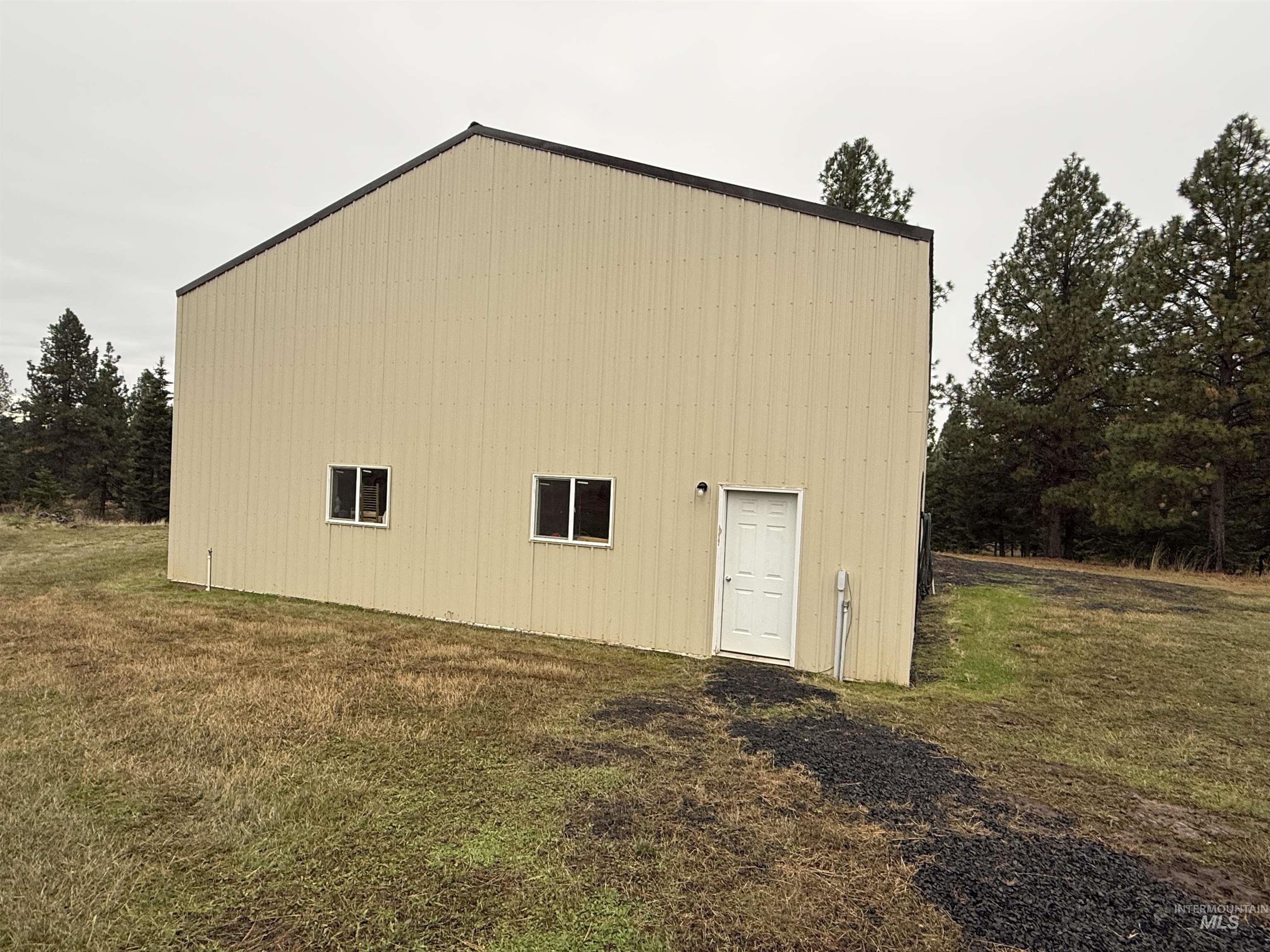 1653 Kidder Ridge Road Kamiah, ID 83536 - Photo 35 of 46 View of green lawn featuring an outbuilding and a garage