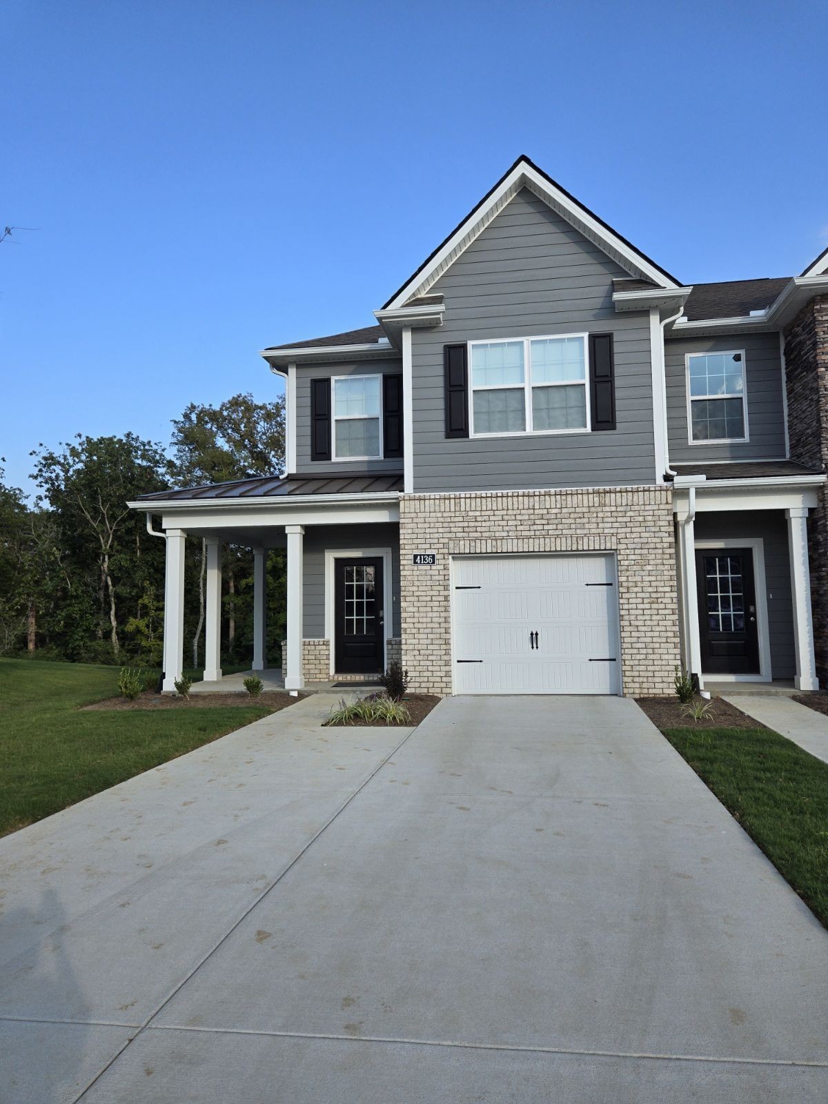 4218 Oswin Drive Murfreesboro, TN 37129 - Photo 40 of 40 a front view of a house with a yard and garage
