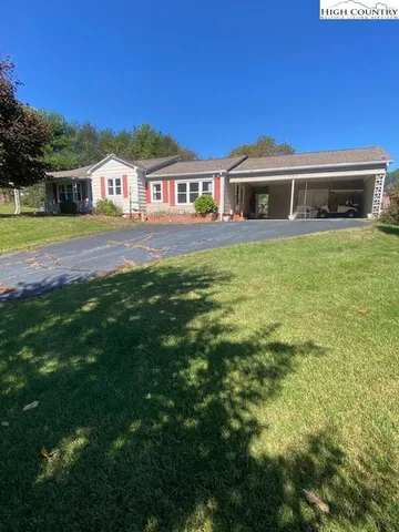 a front view of house with yard and porch