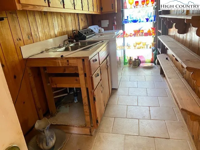 a view of a wooden door and a window