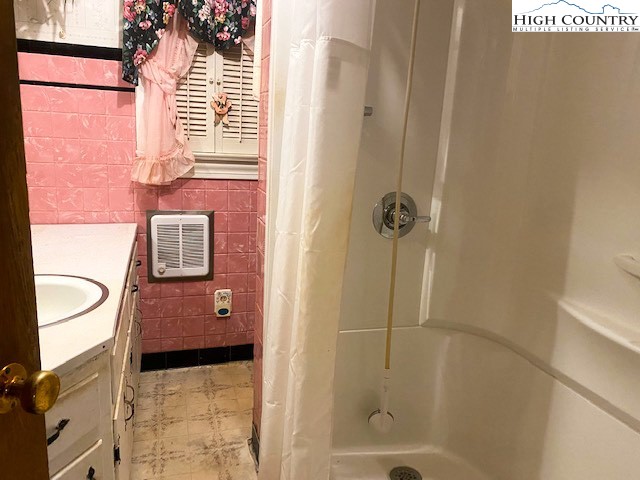 453 Smith Acres Road Ennice, NC 28623 - Photo 23 of 30 a bathroom with a granite countertop shower and a sink