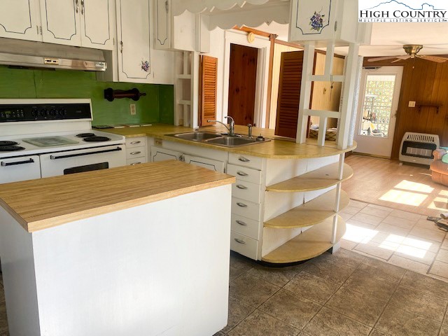 453 Smith Acres Road Ennice, NC 28623 - Photo 24 of 30 a kitchen with stainless steel appliances a stove a sink and a refrigerator