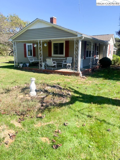 453 Smith Acres Road Ennice, NC 28623 - Photo 26 of 30 a view of a house with swimming pool and porch