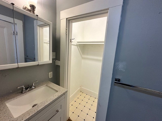 13 Spruce Street, Unit A Waltham, MA 02453 - Photo 8 of 13 a bathroom with a sink and a mirror