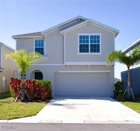 a front view of a house with yard